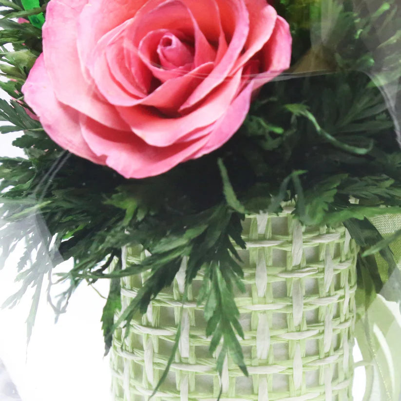 Seven Vibrant Rosy Charm Pink Roses in a Stylish Round Glass Vase