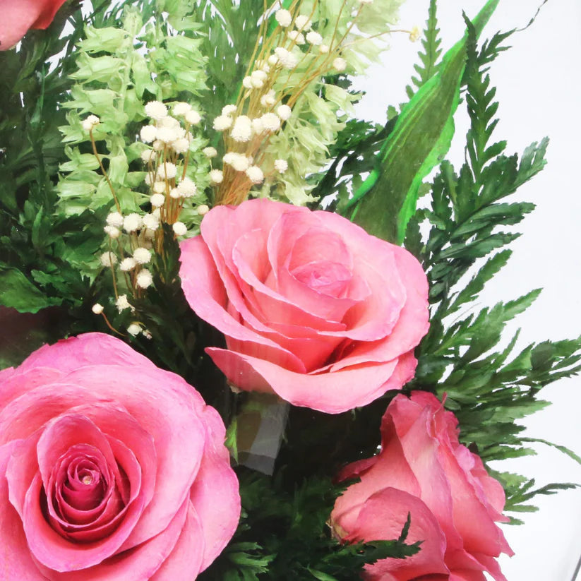 Seven Stunning Pink Roses in a Glass Vase for Enduring Elegance