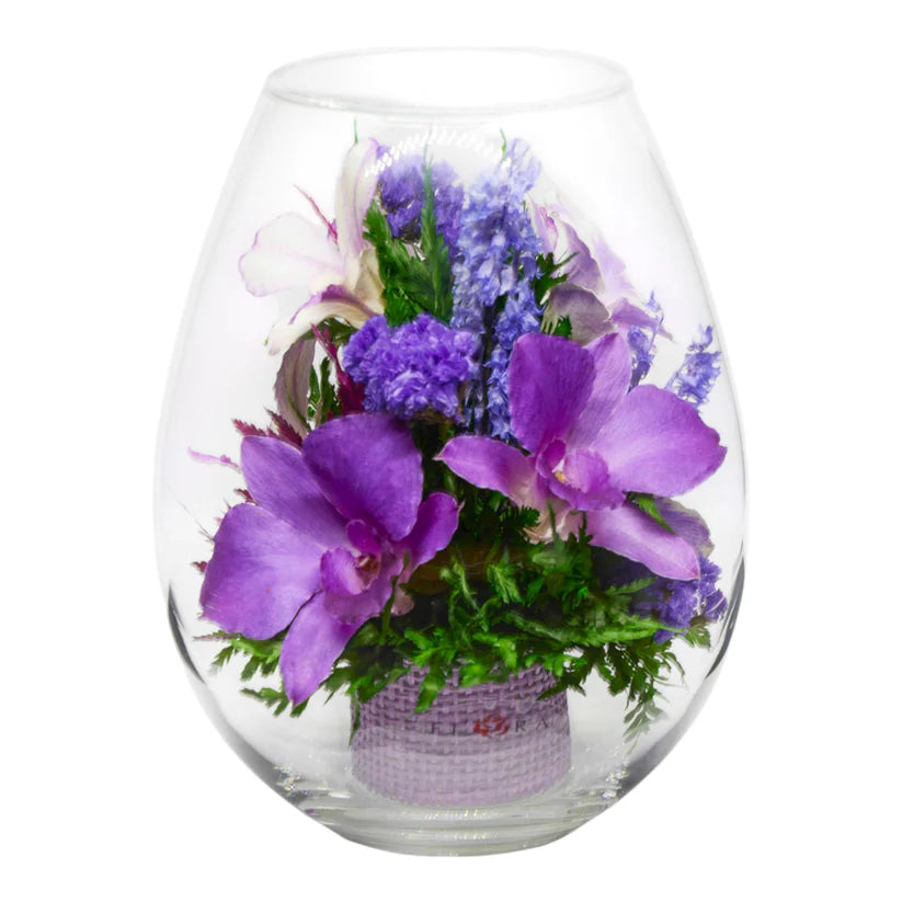 Breathtaking Purple Orchids in a Droplet-Shaped Glass Vase